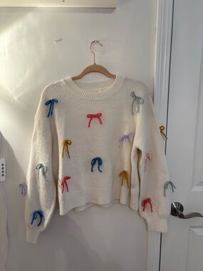 Dry Goods Cream Crewneck Sweater with Multicolored Bow Accents